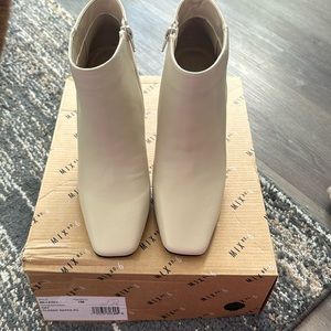Ladies booties, cream color with black heal